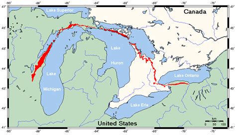 Through Niagara, it runs in an east-west direction, rising about 75 m above the flat bench land along the shore of Lake Ontario. The steeper face of the escarpment is on the north edge, and many of the peninsula's transportation corridors and population centres are on the flat land between escarpment and Lake Ontario.